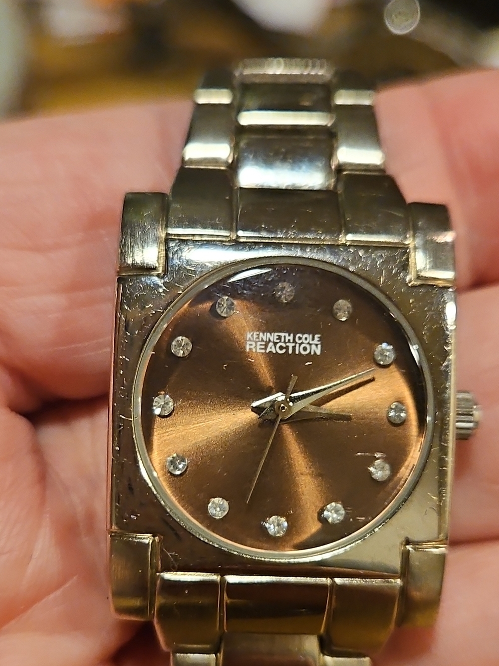 Kenneth Cole Reaction Ladies Gold-Tone Brown Dial Bracelet Watch.